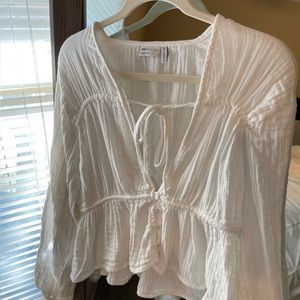 ASOS natural crinkle long sleeve button blouse with the front detail in white.